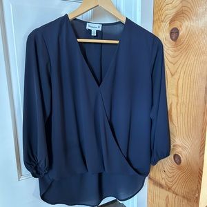 Veronica size small faux wrap blouse shorter in from than back. Size Small
